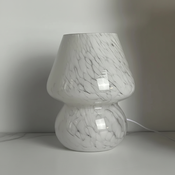 Chic glass mushroom table lamp, enhancing home decor with its unique aesthetic.