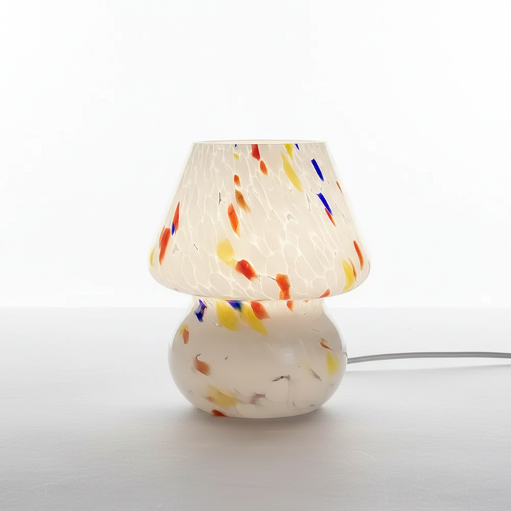Vintage-style glass mushroom lamp, a charming table accent for any room's decor.