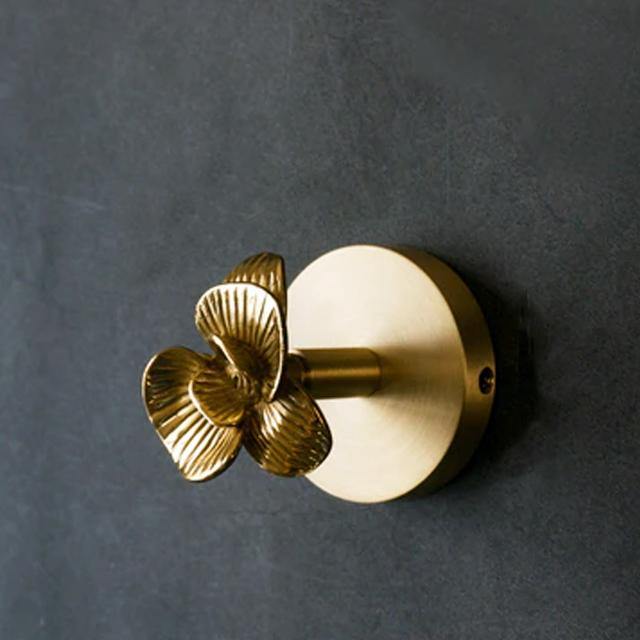 Gold wall hooks featuring elegant animal designs, a stylish and practical home accent.