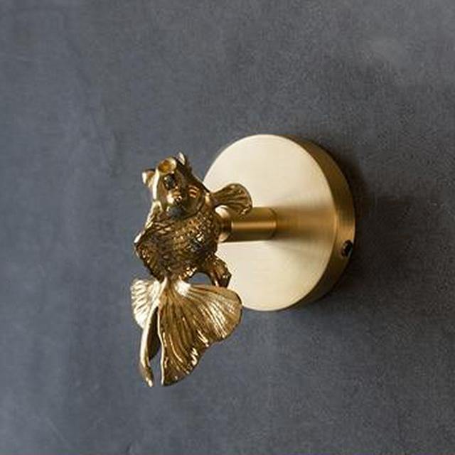 Charming animal wall hooks, finished in gold, perfect for any elegant home decor style.