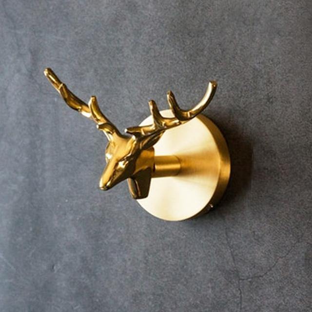 Functional coat rack alternative: decorative gold animal wall hooks for unique home decor.