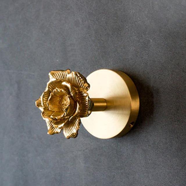 Elegant gold finish animal wall hooks, adding a touch of luxury to your wall decor.