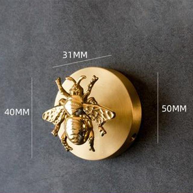 Gold finish decorative hooks, featuring elegant animal designs for wall art.