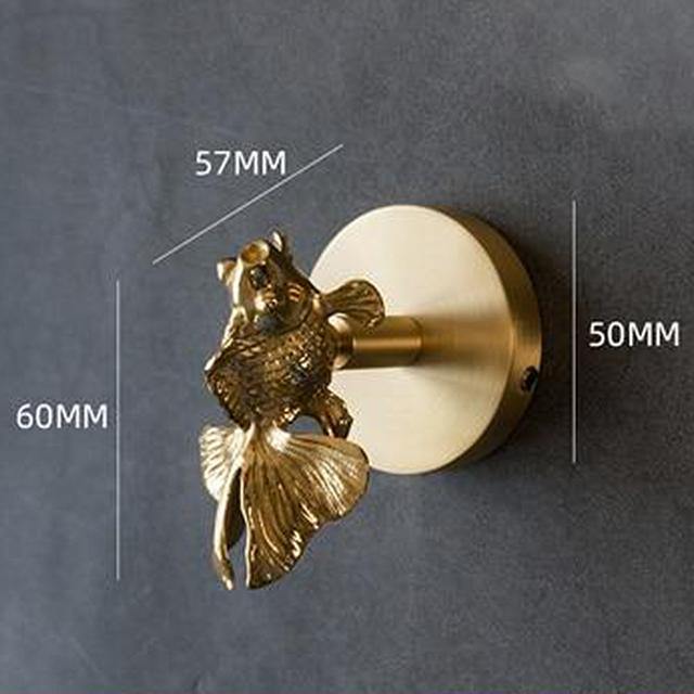 Decorative gold animal hooks, transforming your entryway into an elegant space.