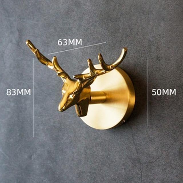 Luxury gold finish animal wall hooks for a sophisticated home decor statement.