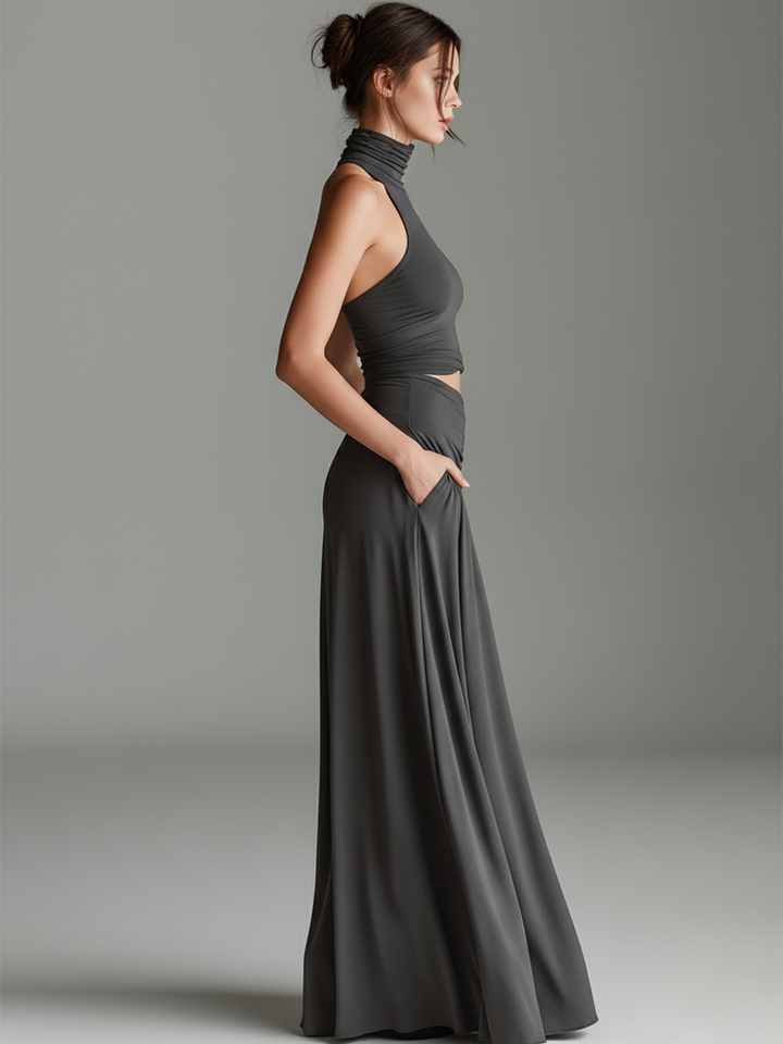 Women's gray halter maxi dress. Elegant formal wear with a unique cutout waist and ruched details.