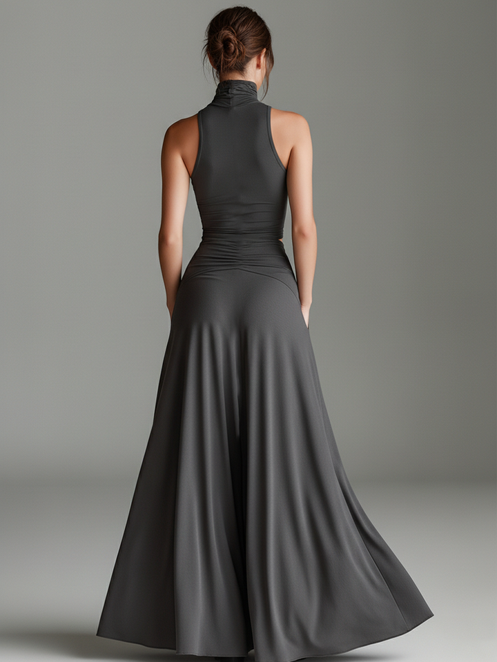 Stylish gray halter maxi dress with an elegant ruched bodice and alluring cutout waist for women.