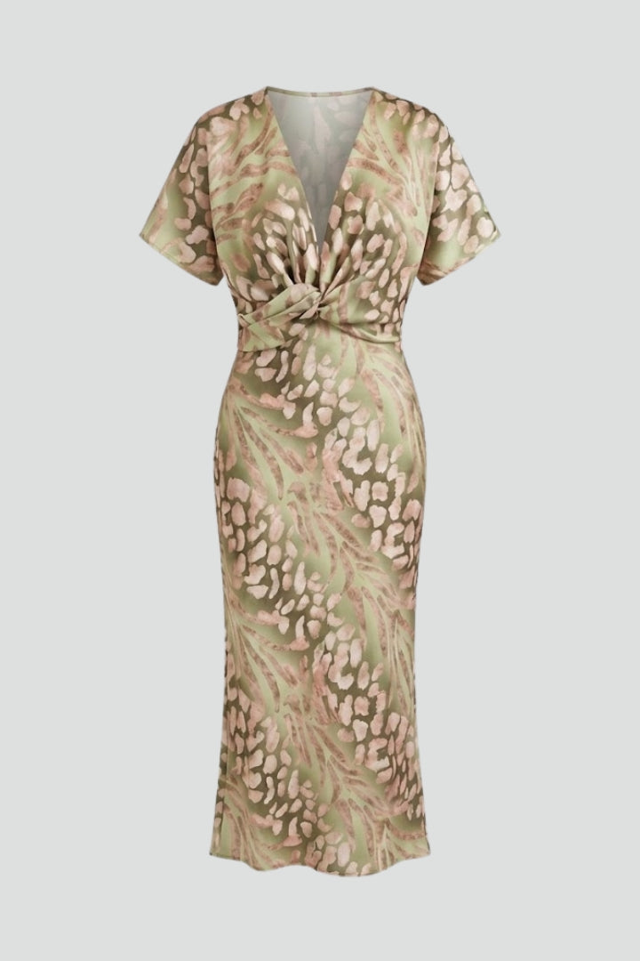 Elegant green floral midi dress with pleated hem, V-neck, and short sleeves, ideal for spring & summer parties.