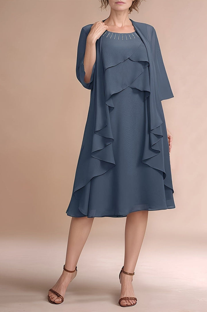Elegant grey pleated midi dress for women, perfect for formal occasions & evening wear. Comfortable & sophisticated fashion.