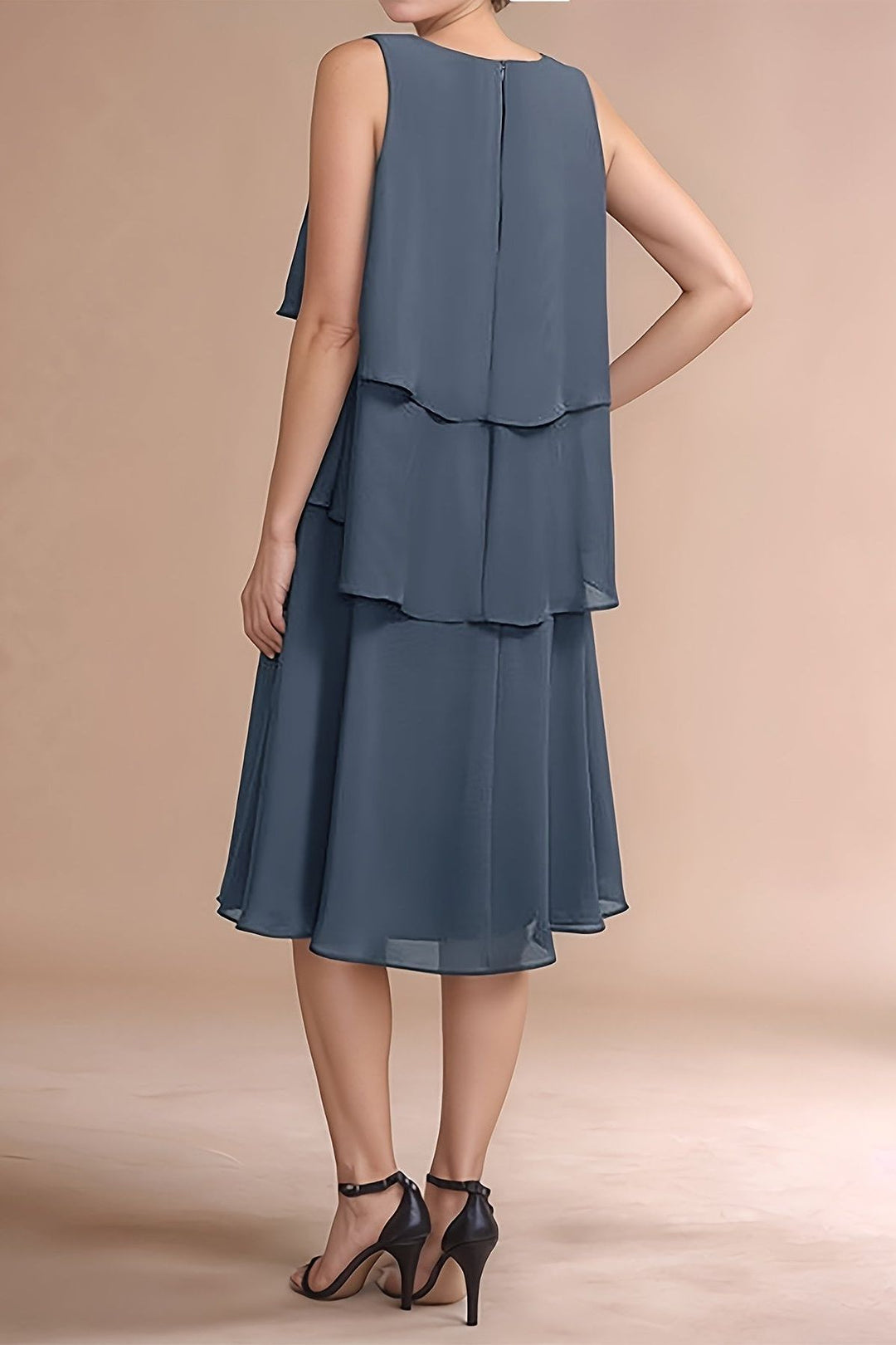 Sophisticated women's grey pleated midi dress. Elegant occasion wear, formal or party. Comfortable and fashionable.