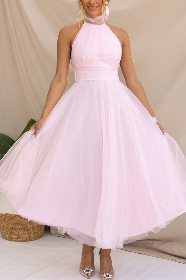 Sophisticated halter maxi wedding guest dress, a flowing long gown for elegant special occasions.