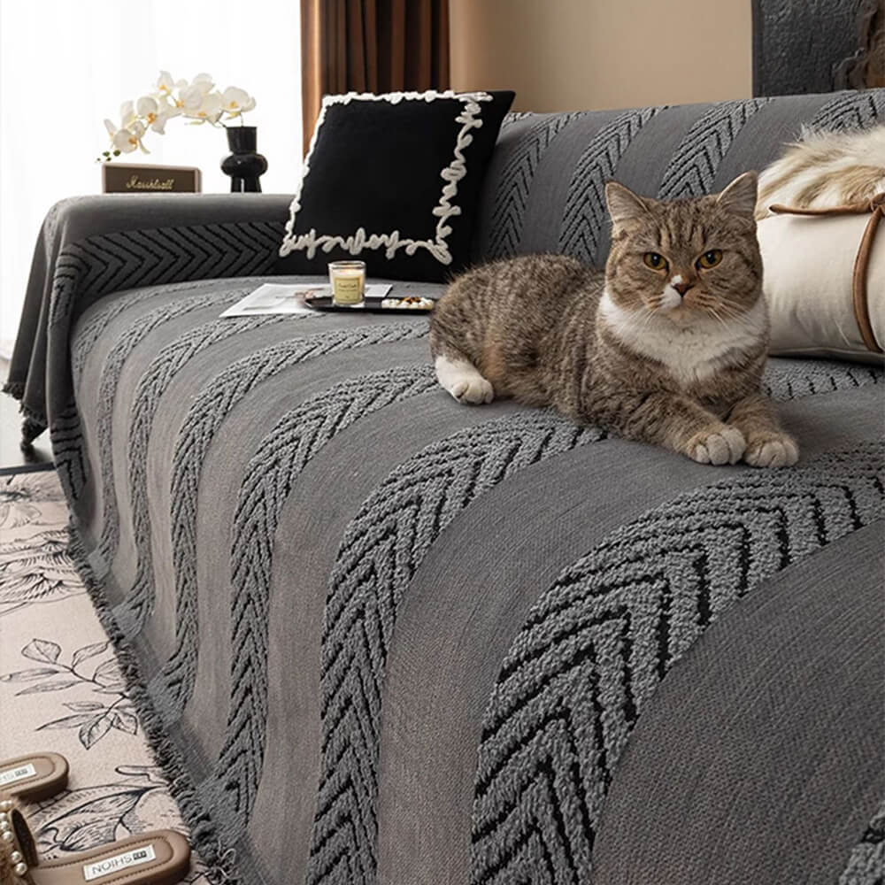 Soft chenille throw cover with a distinctive herringbone pattern, protecting sofas and couches from wear.