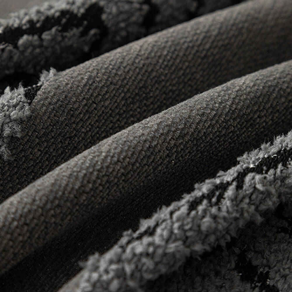 Close-up of the textured herringbone weave on a chenille sofa cover, highlighting its quality.