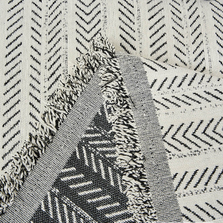 Textured herringbone chenille blanket, perfect for adding a touch of elegance and warmth to any room