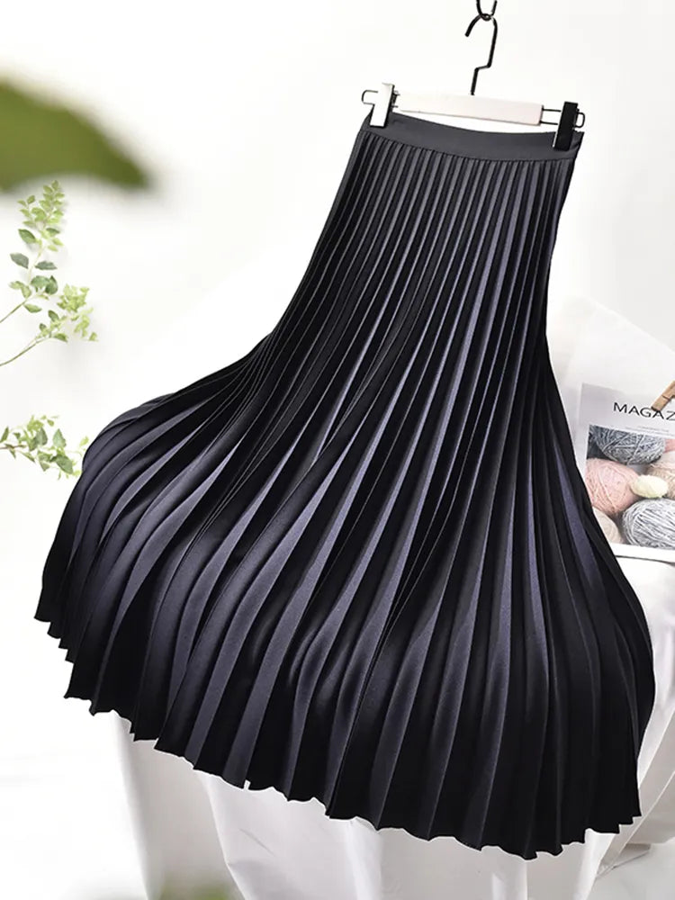 Elegant high waist pleated midi skirt for women. Versatile chic fashion.