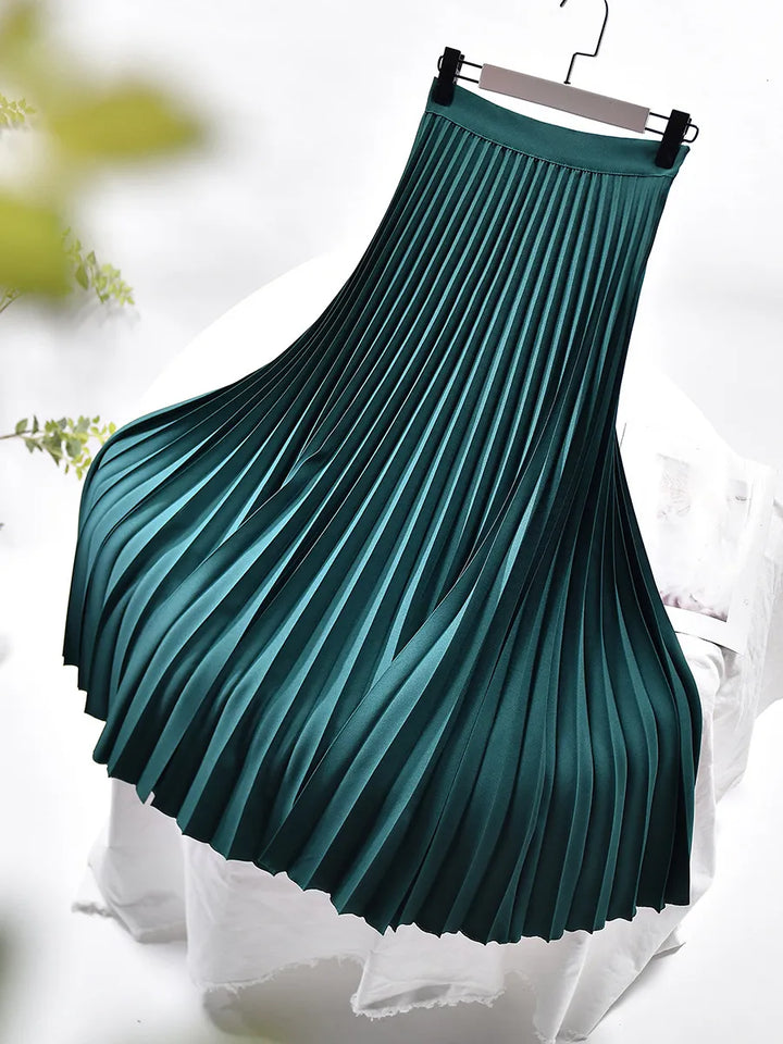 Flowy pleated midi skirt with a high waist, offering an elegant silhouette for women's fashion.