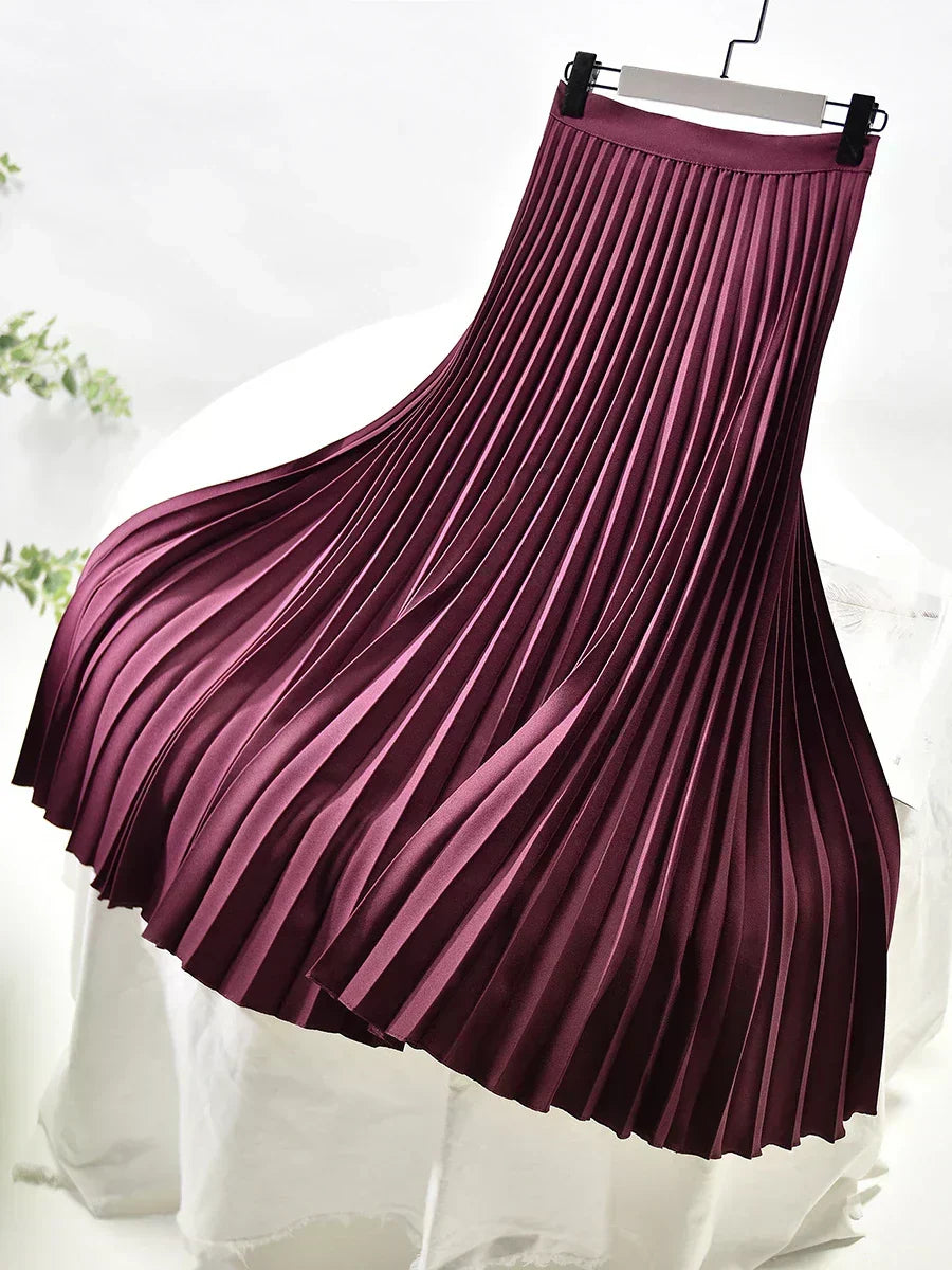 Women's elegant high waist pleated midi skirt. A fashion-forward piece for chic styling.