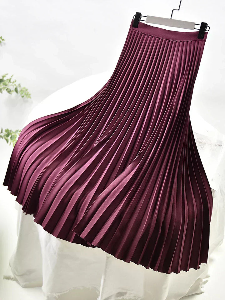 Women's elegant high waist pleated midi skirt. A fashion-forward piece for chic styling.