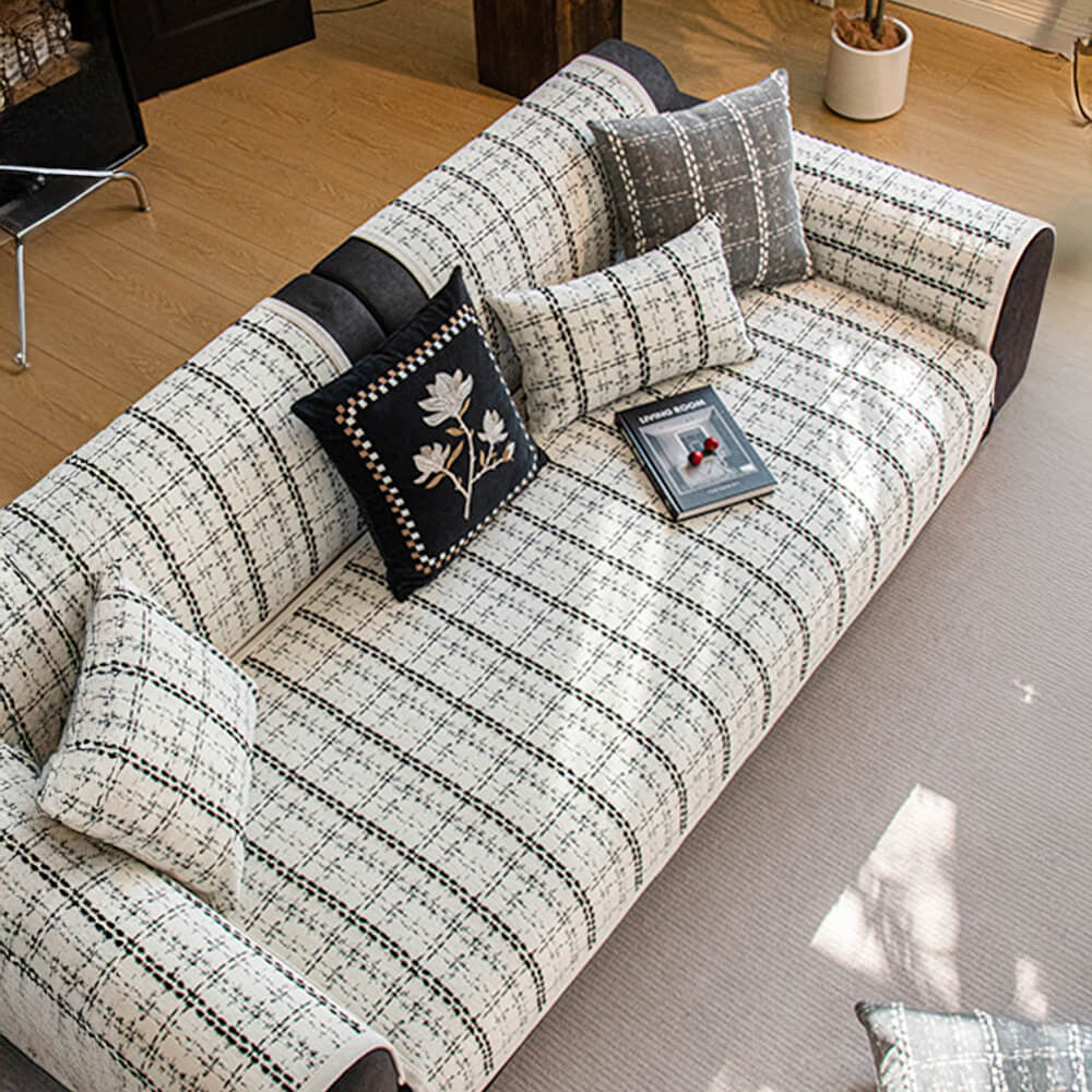 Checkered jacquard sofa cover for all seasons, stylish and non-slip for pet-friendly homes.