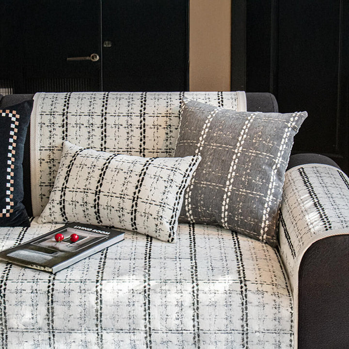 Soft chenille sofa protector with an elegant jacquard pattern, perfect for furniture protection.