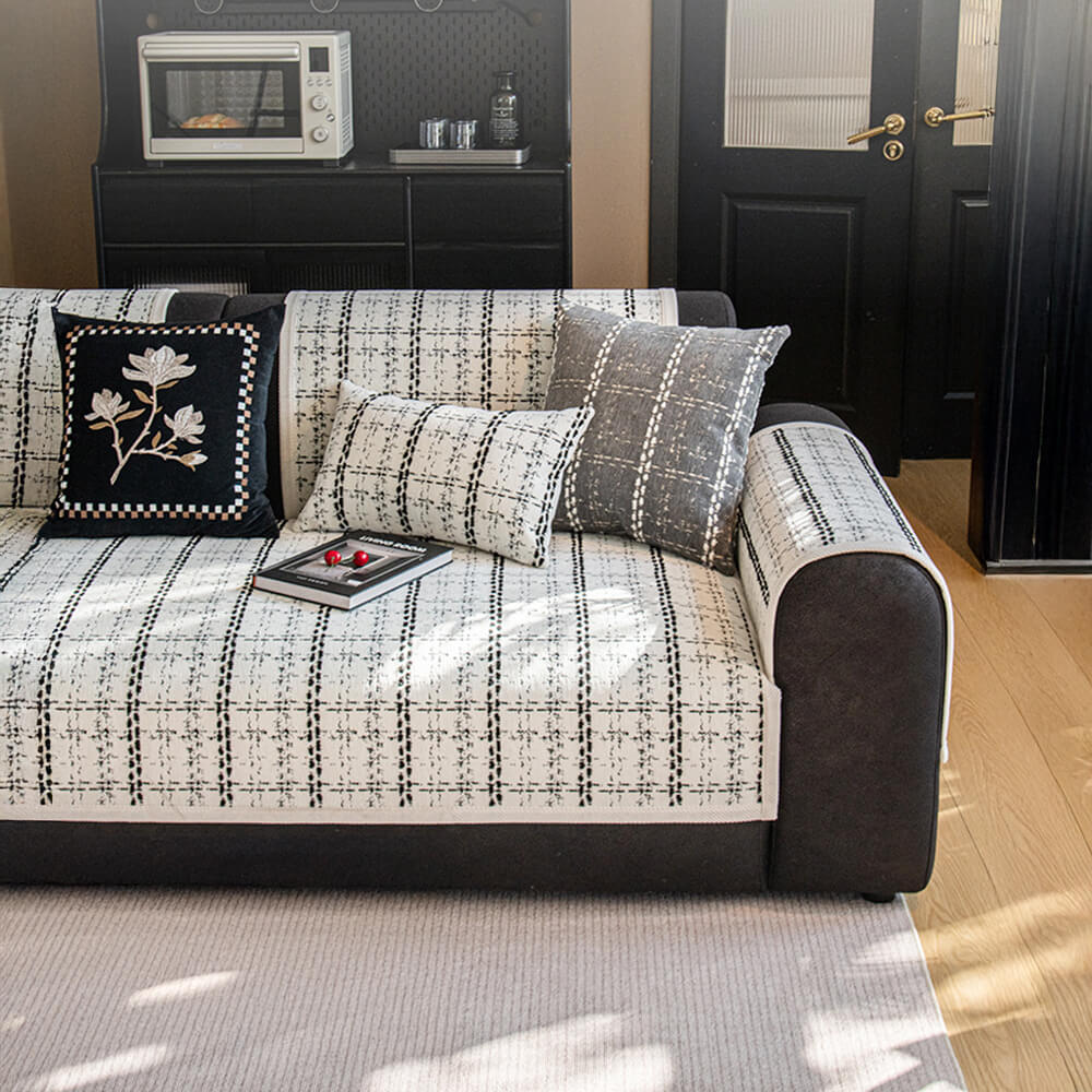 Elegant non-slip chenille sofa cover with a delicate jacquard checkered pattern for home decor.