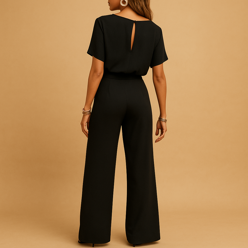 Beige women's tailored jumpsuit with flowy sleeves, a chic choice for wedding guests.