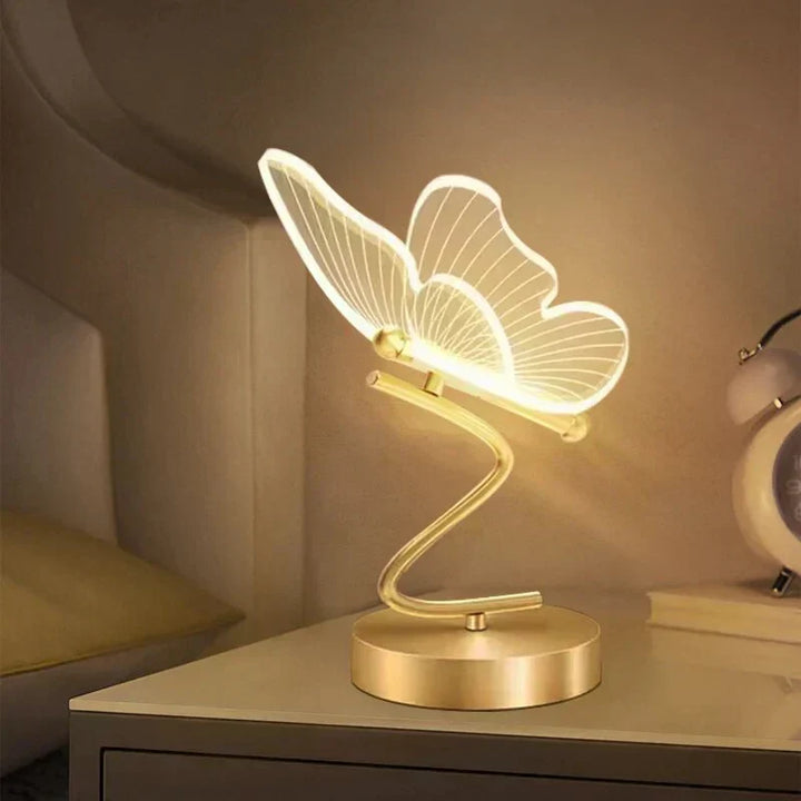 Elegant LED table lamp with delicate butterfly design. Perfect modern lighting for home & office decor.