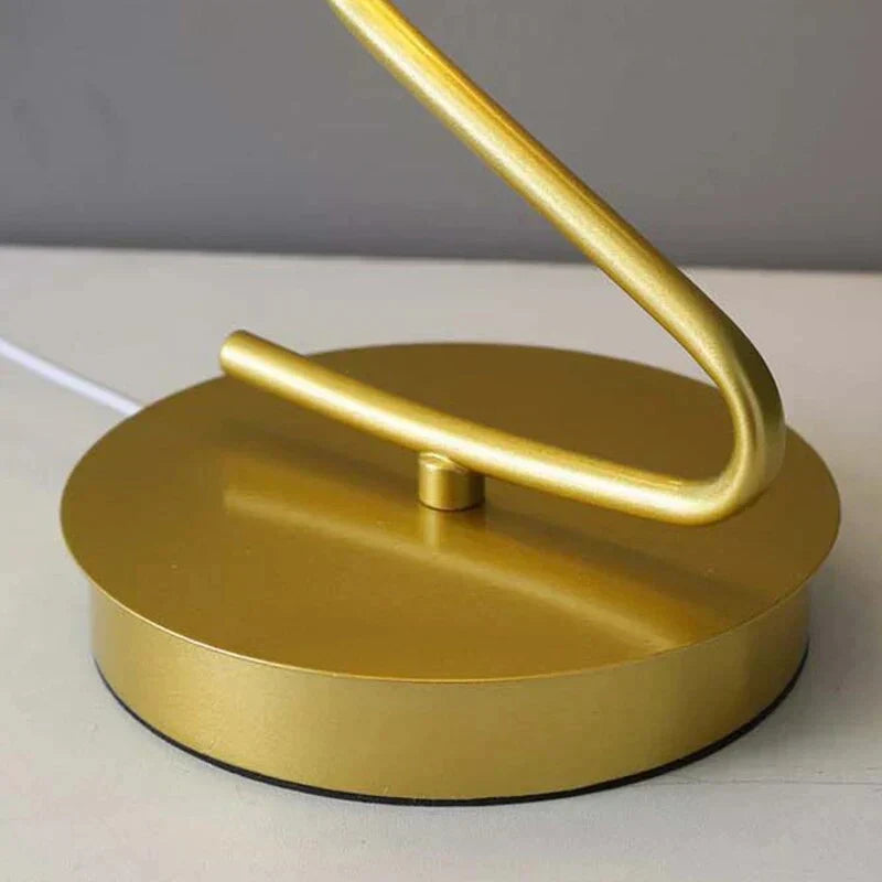 Whimsical butterfly LED table lamp emitting soft, decorative light. Perfect ambient lamp for a cozy home or office.