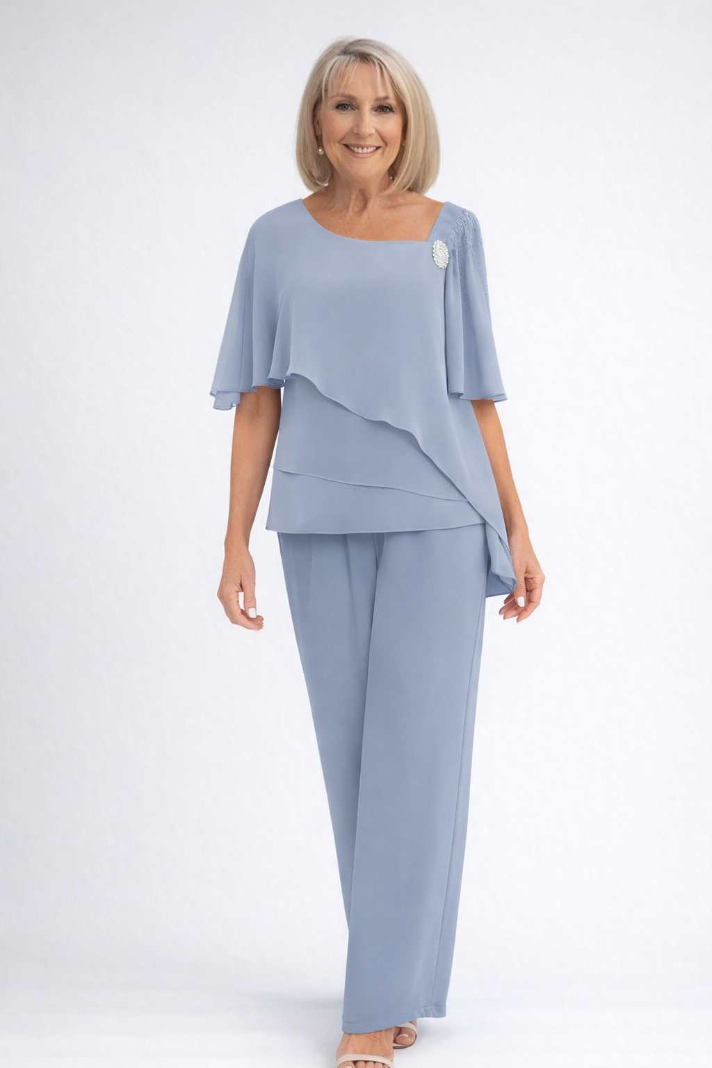 Elegant light blue women's cape top and trouser set, perfect for formal events & wedding guests.
