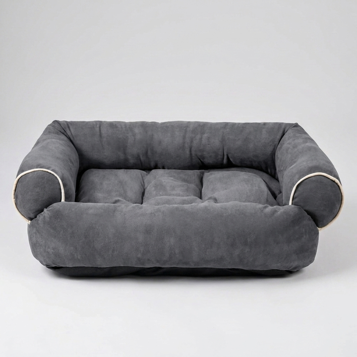 A happy dog comfortably sleeping on its luxurious pet sofa bed. Ideal for large or small dogs.