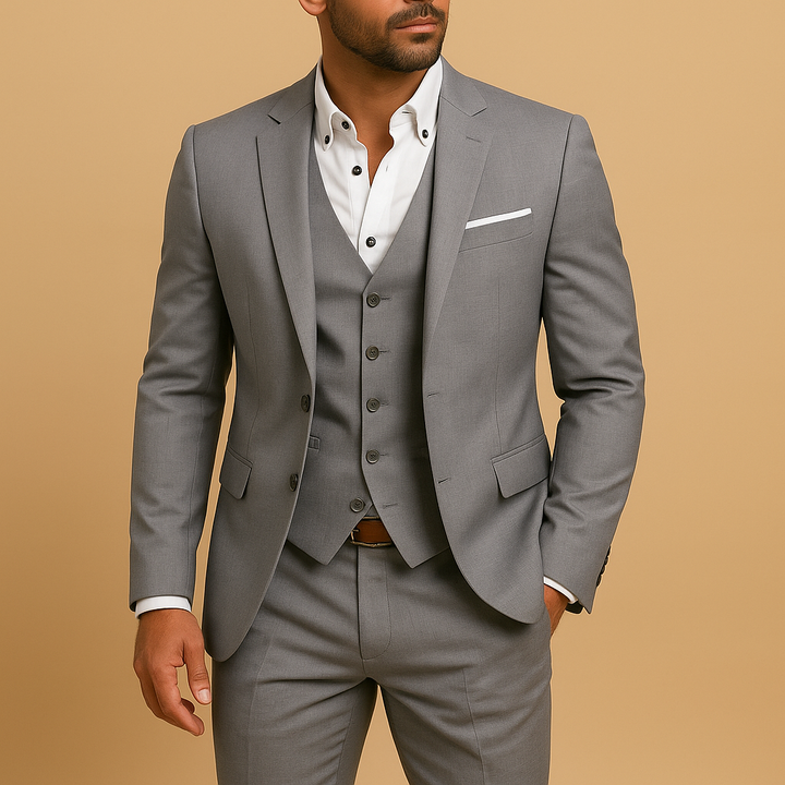 Stylish men's slim fit 3-piece suit featuring a vest and classic lapel, ideal for modern formal wear.