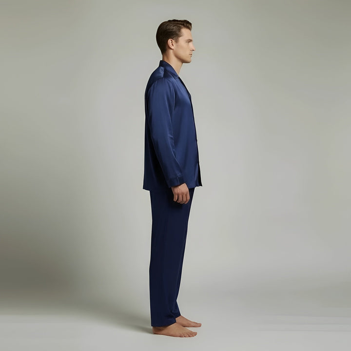 Comfortable men's navy blue satin sleepwear set, featuring a long sleeve shirt and matching pants. Perfect for nightwear.