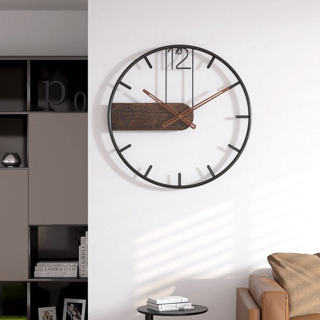 Decorative modern wall clock featuring a stylish wood accent. Perfect silent timepiece for elegant home or office decor.