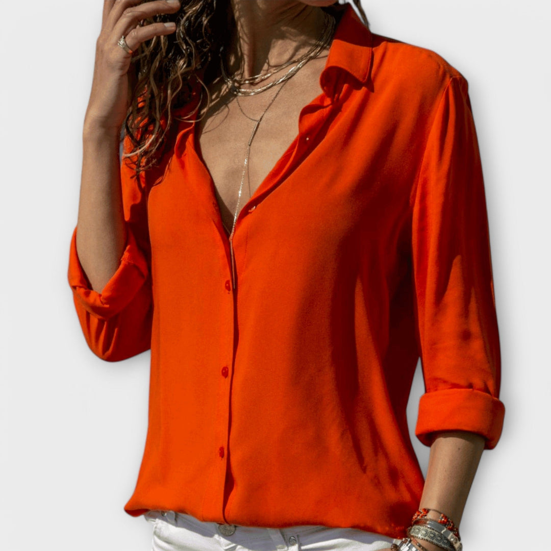 Chic women's tailored blouse for professional office wear. Elegant long sleeve top, business casual style.