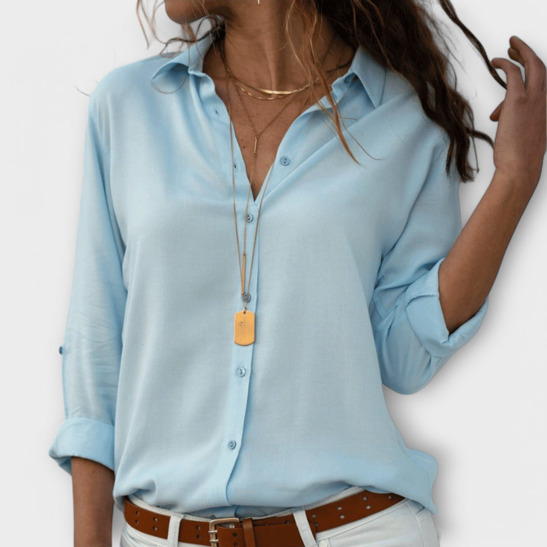Modern multi-color women's blouse, versatile for elegant office or chic evening apparel. Long sleeve.