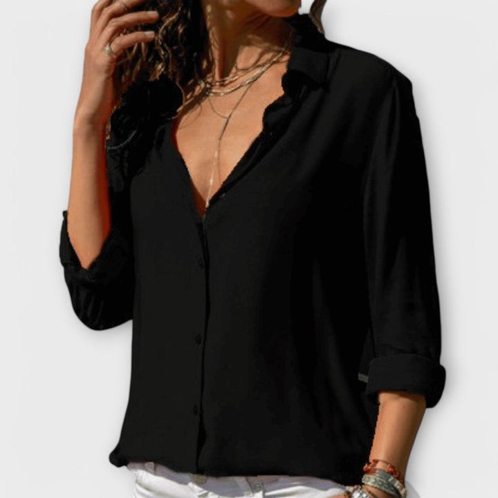 Chic women's blouse with long sleeves, ideal for elegant office or stylish evening wear. Multi-color design.