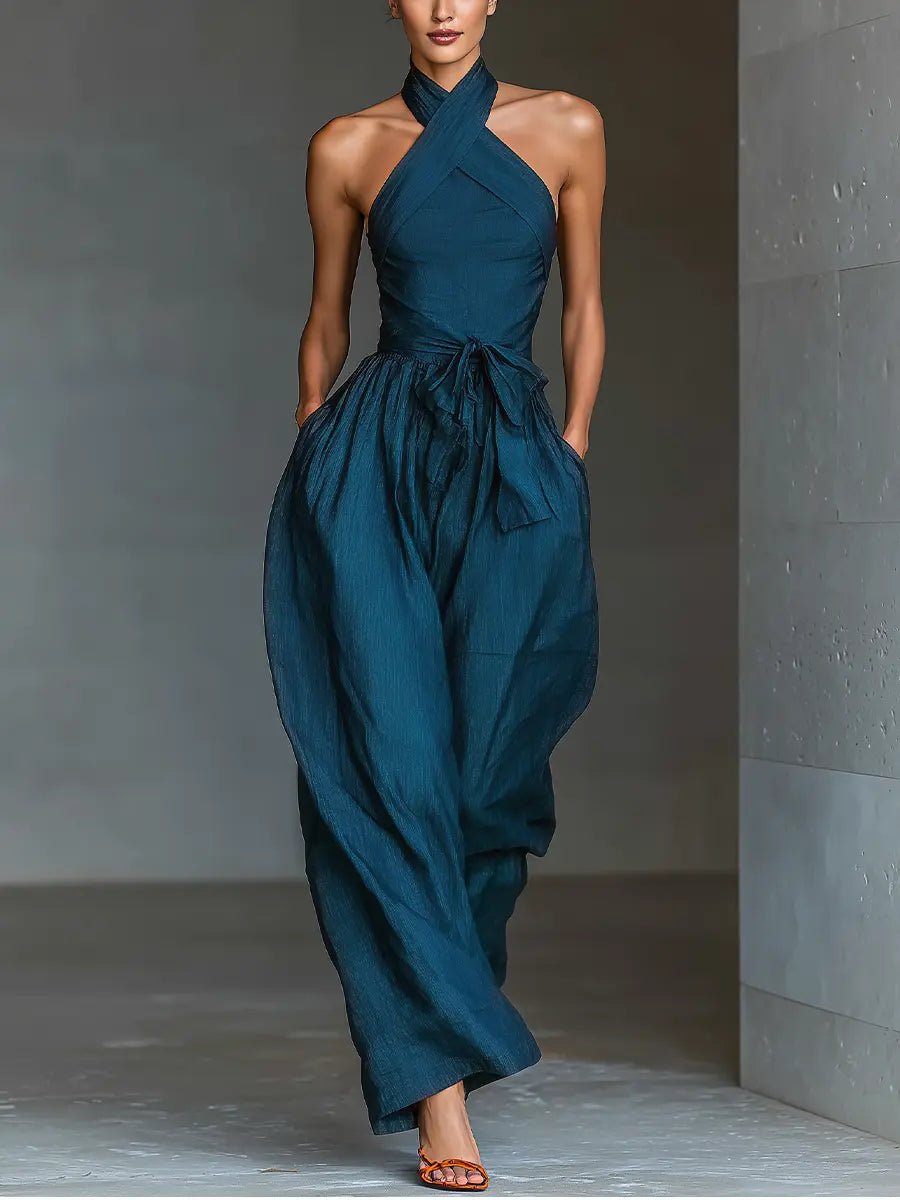 Elegant navy blue halter wide-leg jumpsuit for women, perfect for formal occasions or parties.