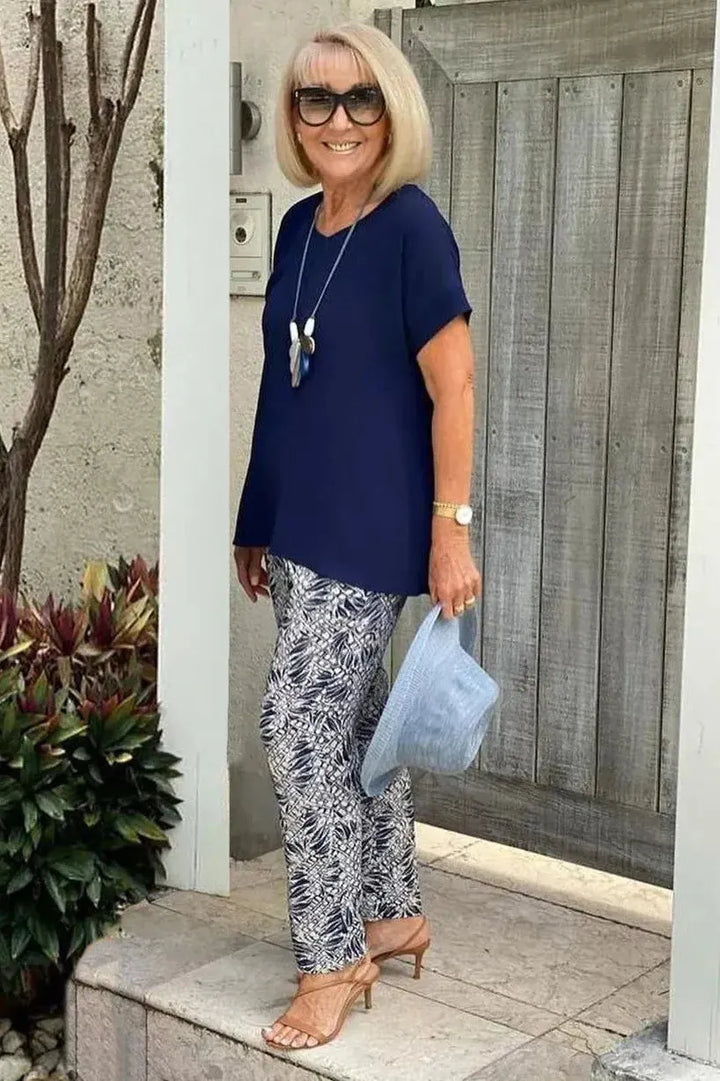 Relaxed fit women's navy blue patterned blouse, a stylish and comfortable top for versatile wear.