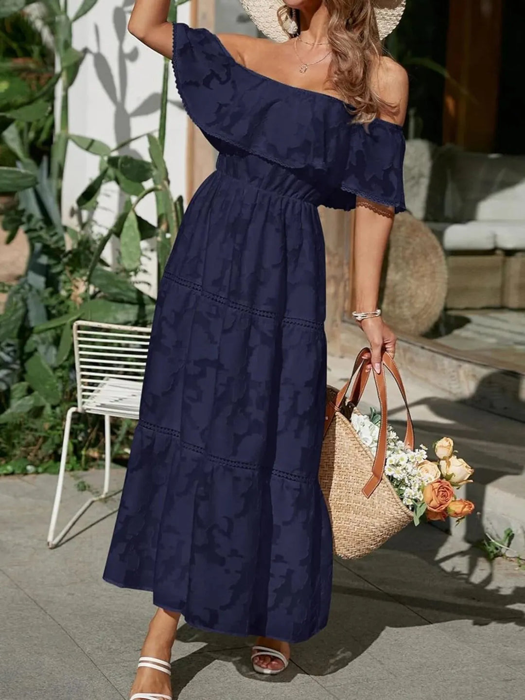 Sophisticated off-shoulder maxi dress featuring tiered ruffles, an elegant wedding guest ensemble.