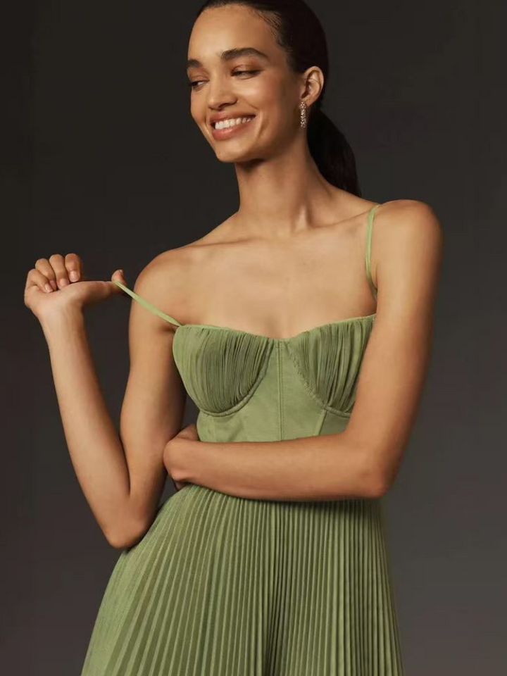 Versatile olive green corset pleated maxi dress. Elegant women's fashion for wedding guests, formal evenings & parties.