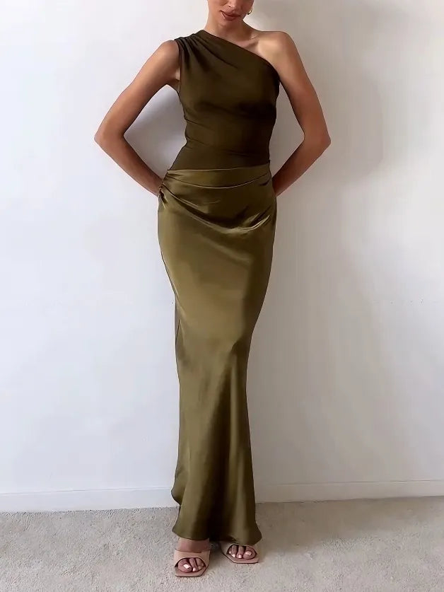 Elegant bias-cut maxi dress for women, featuring a one-shoulder neckline and flattering ruched waist. Formal occasion wear.