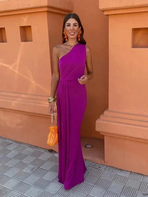 Stunning orange one-shoulder maxi dress with elegant draping, ideal for wedding guests or gala events.