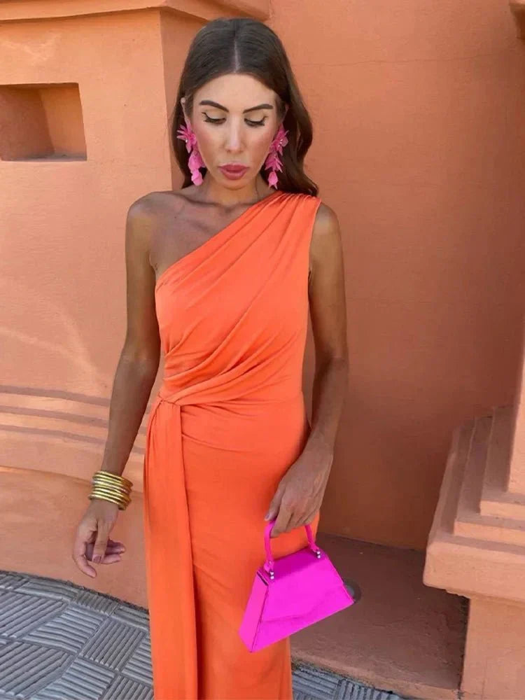 Graceful purple one-shoulder formal maxi dress. A chic evening gown for wedding guests and special events.
