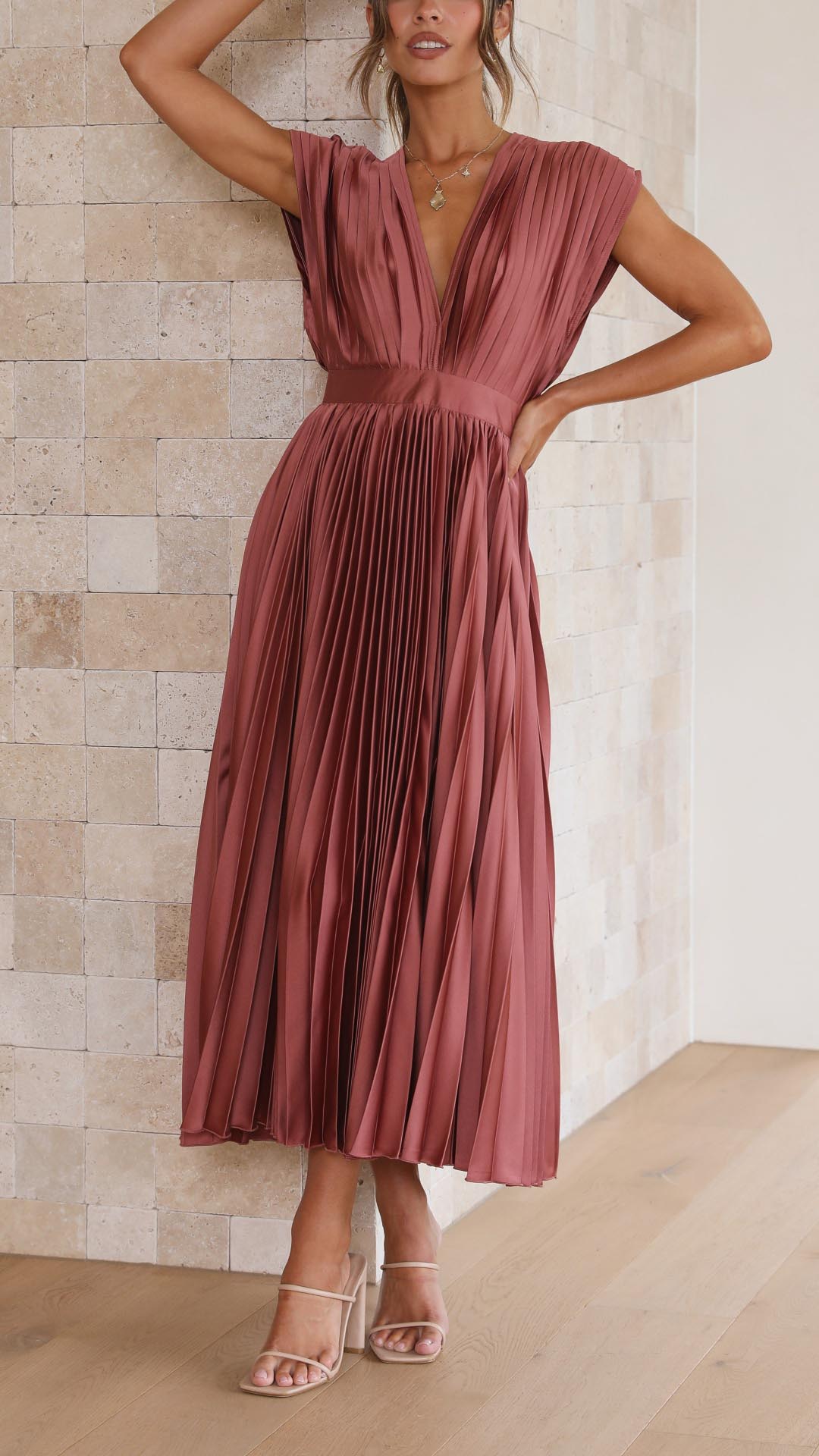 Formal V-neck pleated midi dress in black, timeless and elegant for women's events.