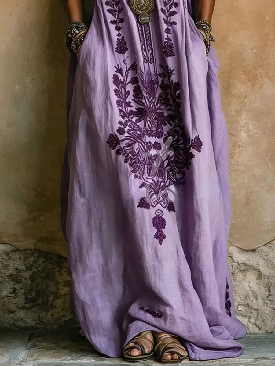 Stunning purple kaftan maxi dress with elegant embroidery, V-neck, and chic batwing sleeves. Loose fit for comfort.
