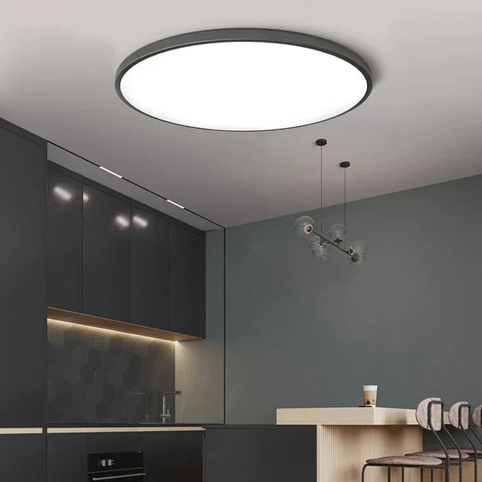 Sleek round LED ceiling lamp, contemporary design for living spaces.