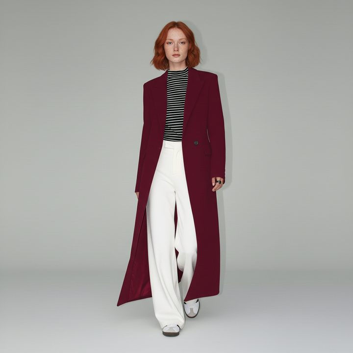 Autumn/winter women's ruby long tailored coat, fitted silhouette, elegant structured city outerwear.