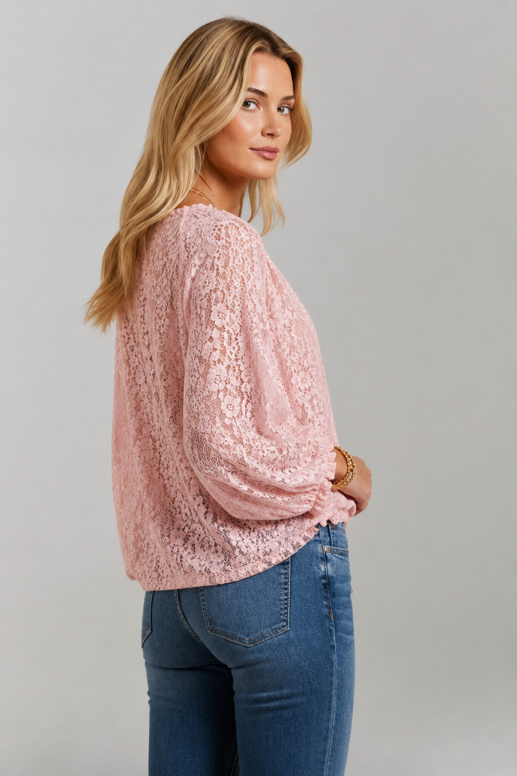 Loose-fit sheer lace tie-neck blouse for women, an elegant fashion top suitable for various occasions.