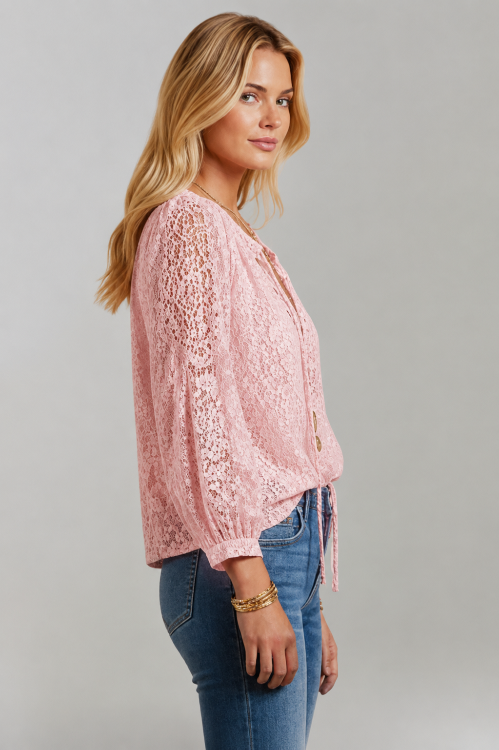 Fashionable women's sheer lace tie-neck blouse, an elegant top for casual or semi-formal wear.