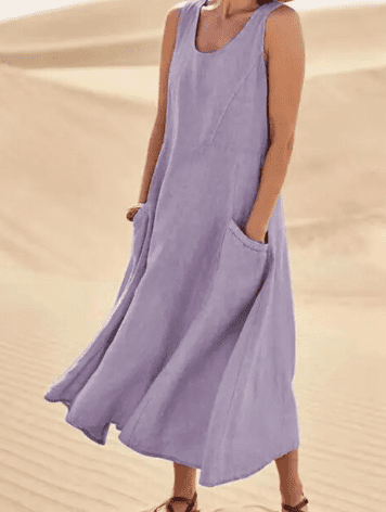 Casual spring women's dress: sleeveless, loose fit, comfortable midi length, and convenient pockets for everyday style.